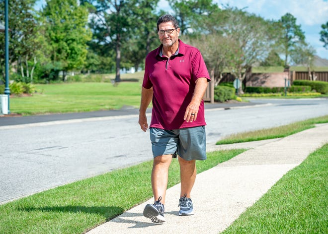 Photo of Patrick Dubois walking after his robotic knee replacement.